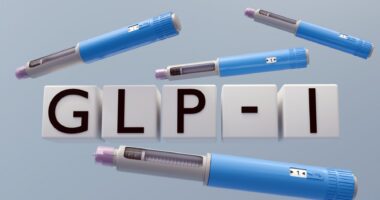 A 3D illustration of a gray syringe pen with the letters spelling 