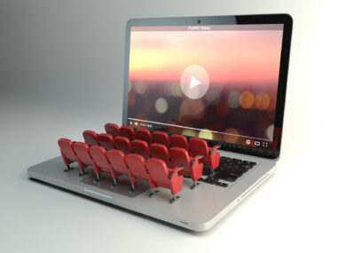 An image shows a laptop with rows of seats on the keyboard.