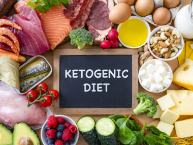 A photo shows salmon, tuna, and other ingredients of a ketogenic diet.