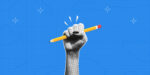 Illustration of a raised hand holding a pencil against a blue background.