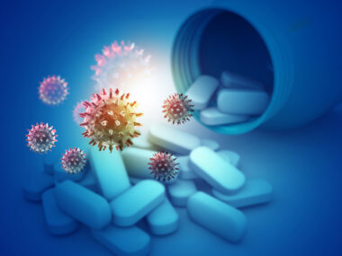 Illustration shows viruses floating above pills spilling out of a bottle.