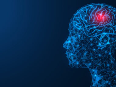 A red spot is seen in a brain within a human head constructed of blue lines and bright dots.