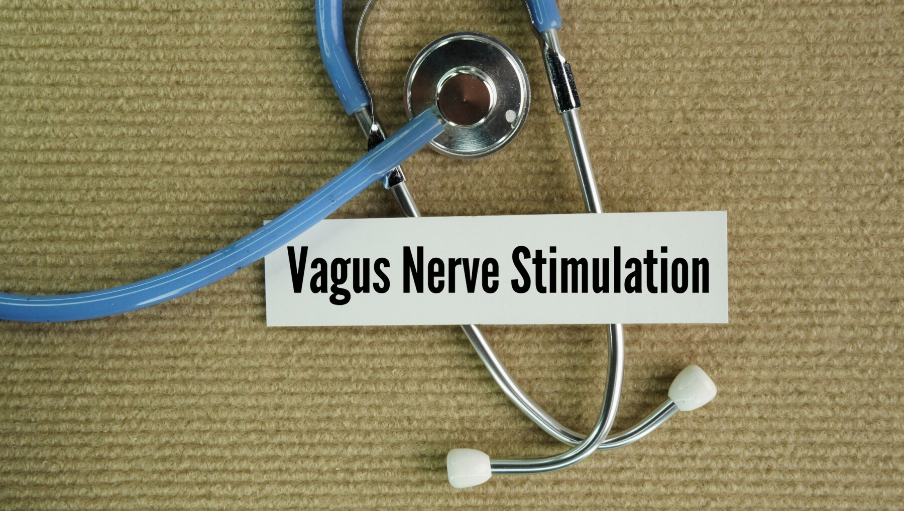 Image of a stethoscope beside a card reading “Vagus Nerve Stimulation.”